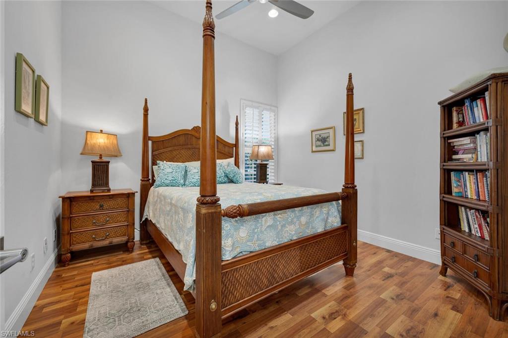 400 Terracina Way Naples, FL 34119 - Photo 13 of 29 Bedroom featuring hardwood / wood-style flooring and ceiling fan
