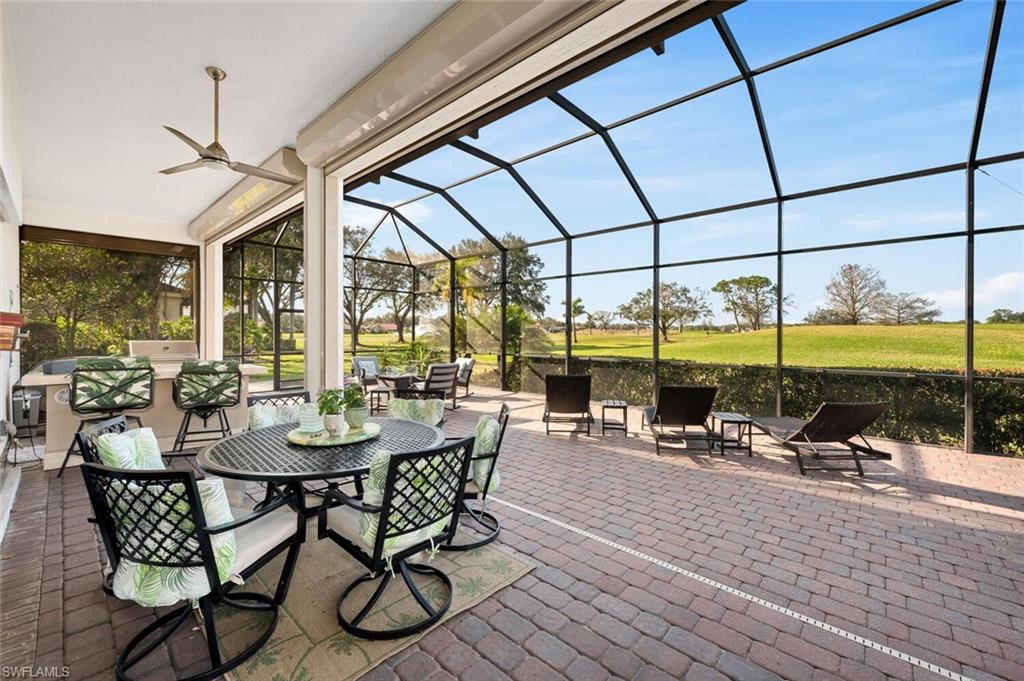 400 Terracina Way Naples, FL 34119 - Photo 22 of 29 View of patio / terrace with glass enclosure and ceiling fan