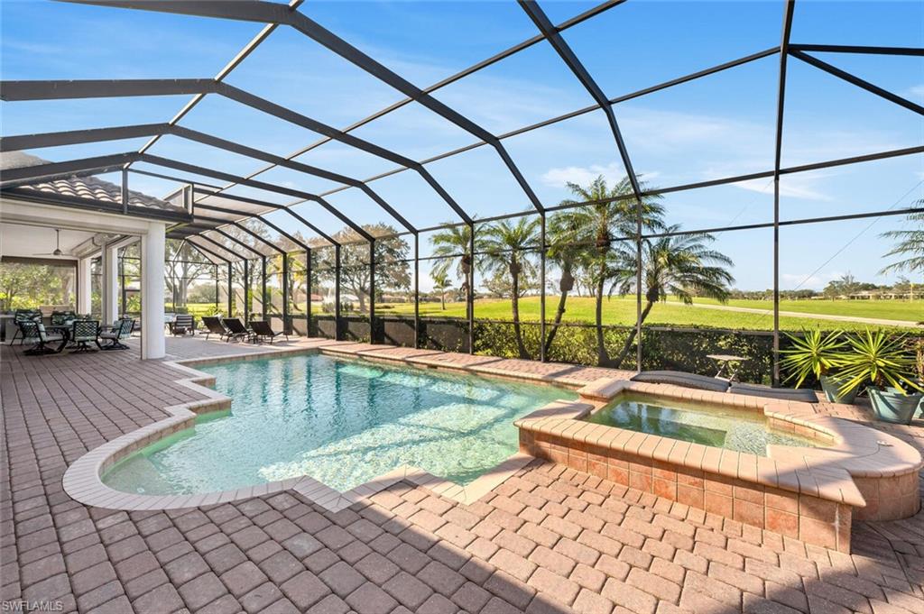 400 Terracina Way Naples, FL 34119 - Photo 25 of 29 View of swimming pool with a patio area, a lanai, and an in ground hot tub