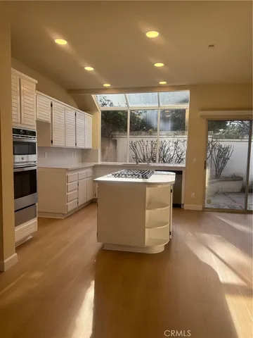 a view of a door and an empty room