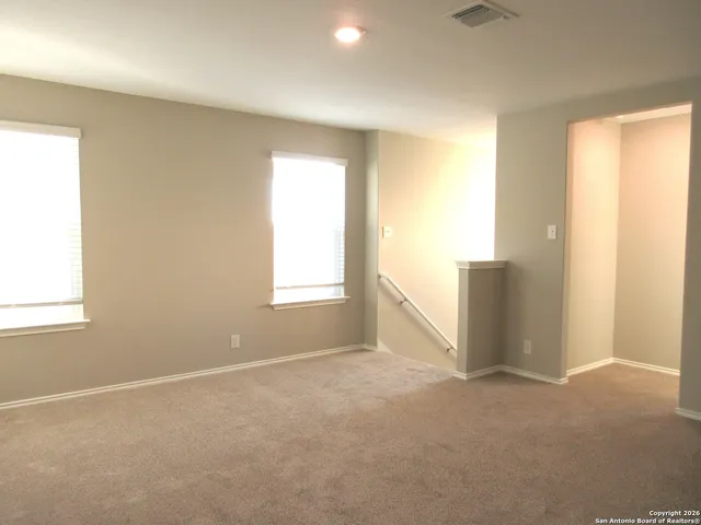 an empty room with windows