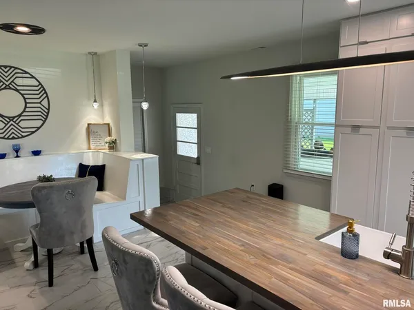 a bed room with a bed window and a chair