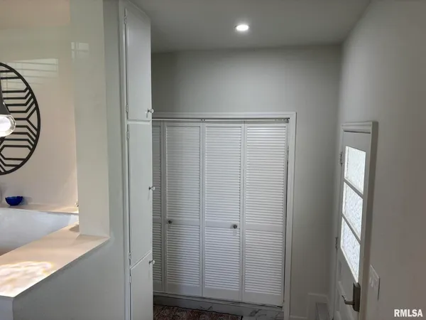 a view of hallway with washer and dryer
