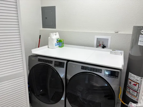 a utility room with dryer and washer