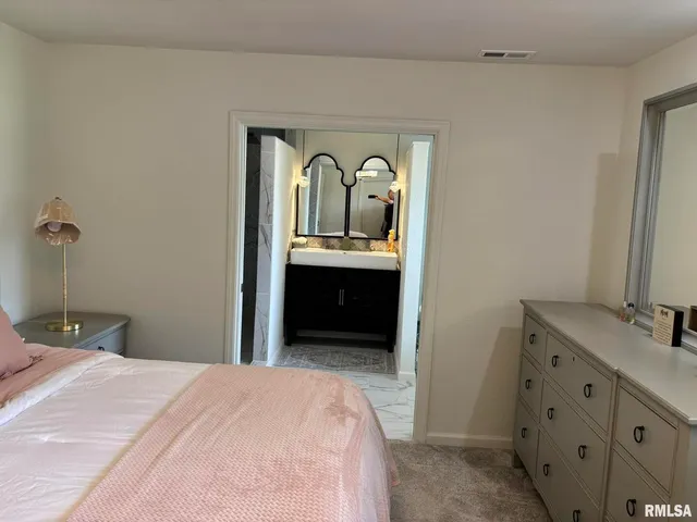 a bathroom with a shower and a mirror