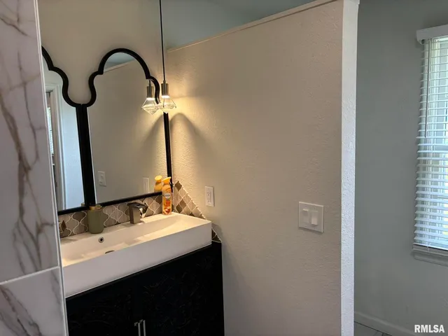 a bathroom with a toilet and a sink