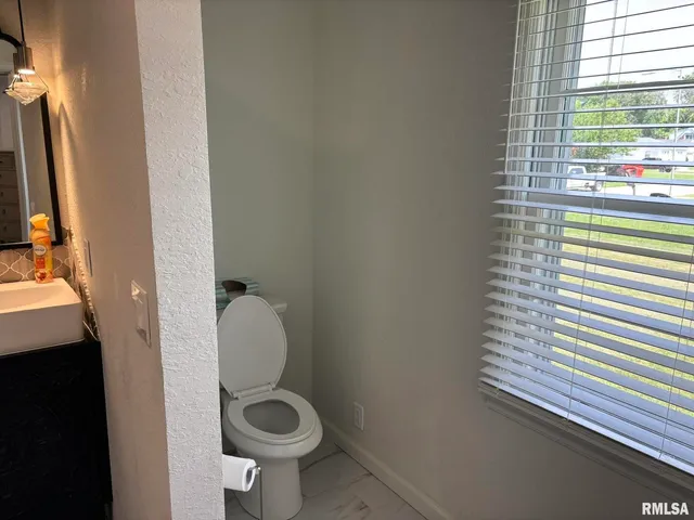 a bathroom with a glass shower door