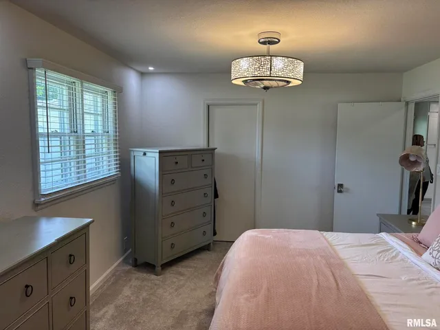 a view of walk in closet with clothes