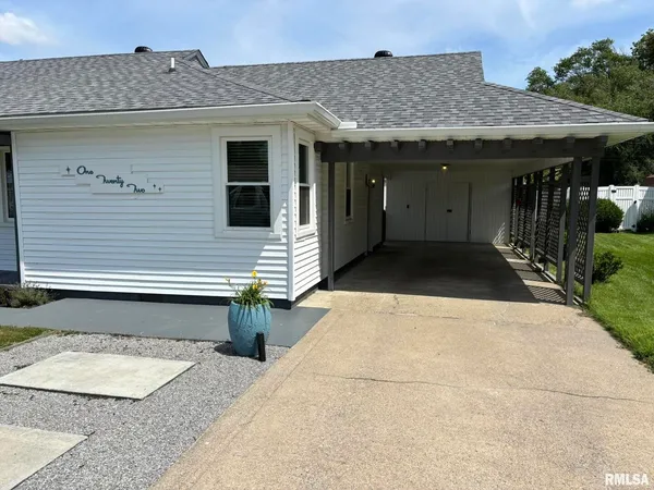 a front view of a house with barbeque area