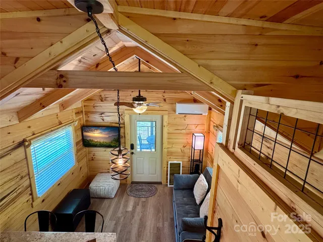 a view of a chairs and table in the balcony