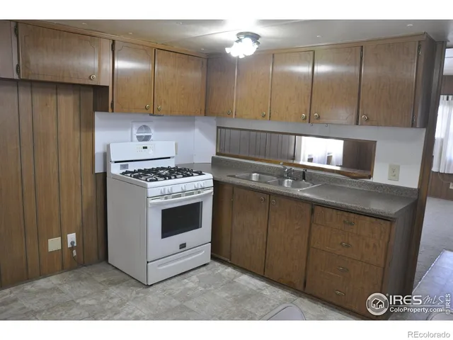 a kitchen with cabinets and appliances