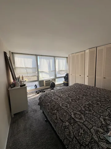 a bed room with a bed and a couch