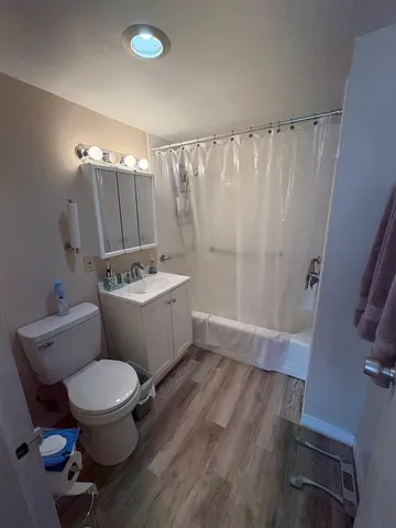 a white toilet sitting next to a bathroom sink
