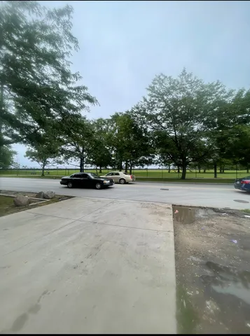 a view of outdoor space with deck and trees