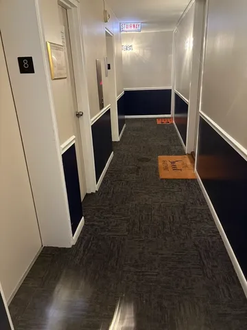 a view of gallery with wooden floor