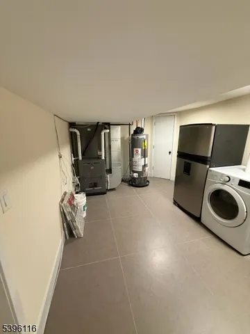 a view of a storage & utility room with washer and dryer