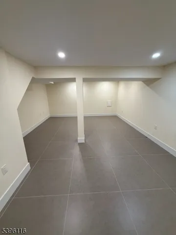 an empty room with a empty space and windows