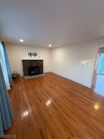 a view of a room with a sink and a mirror