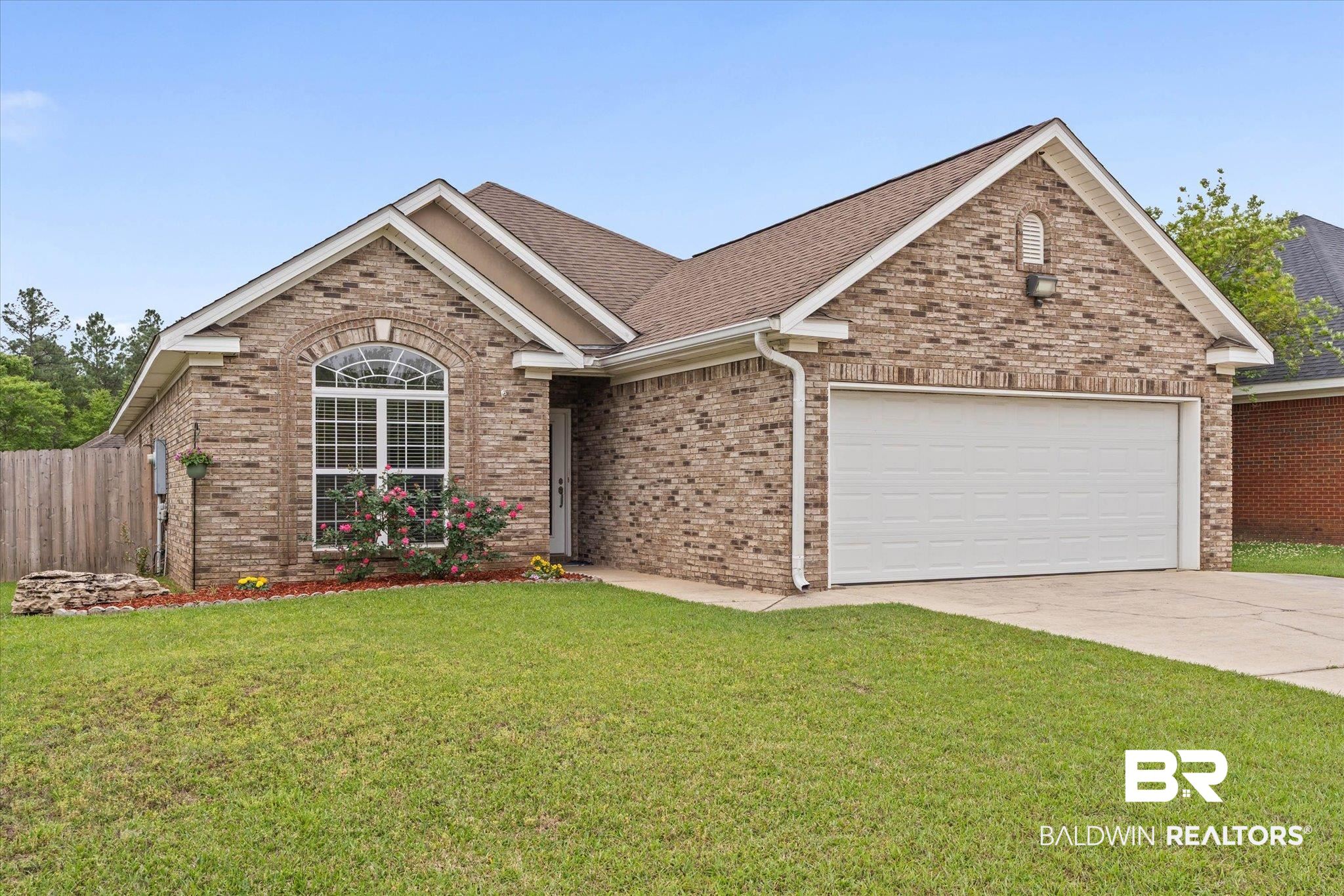 1003 Weatherby Street South Saraland, AL 36571 - Photo 2 of 31 Ranch-style home featuring brick siding, a garage, concrete driveway, and a shingled roof