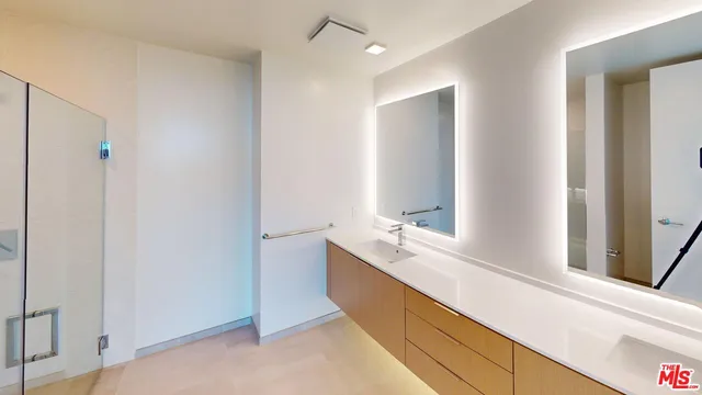 a bathroom with a double vanity sink mirror and double