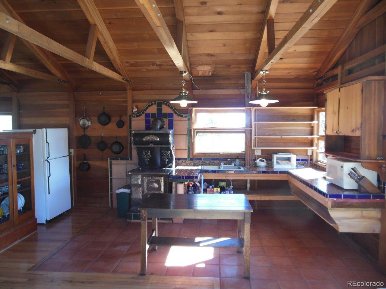 481 San Miguel Road Westcliffe, CO 81252 - Photo 14 of 26 a room with lots of furniture and window
