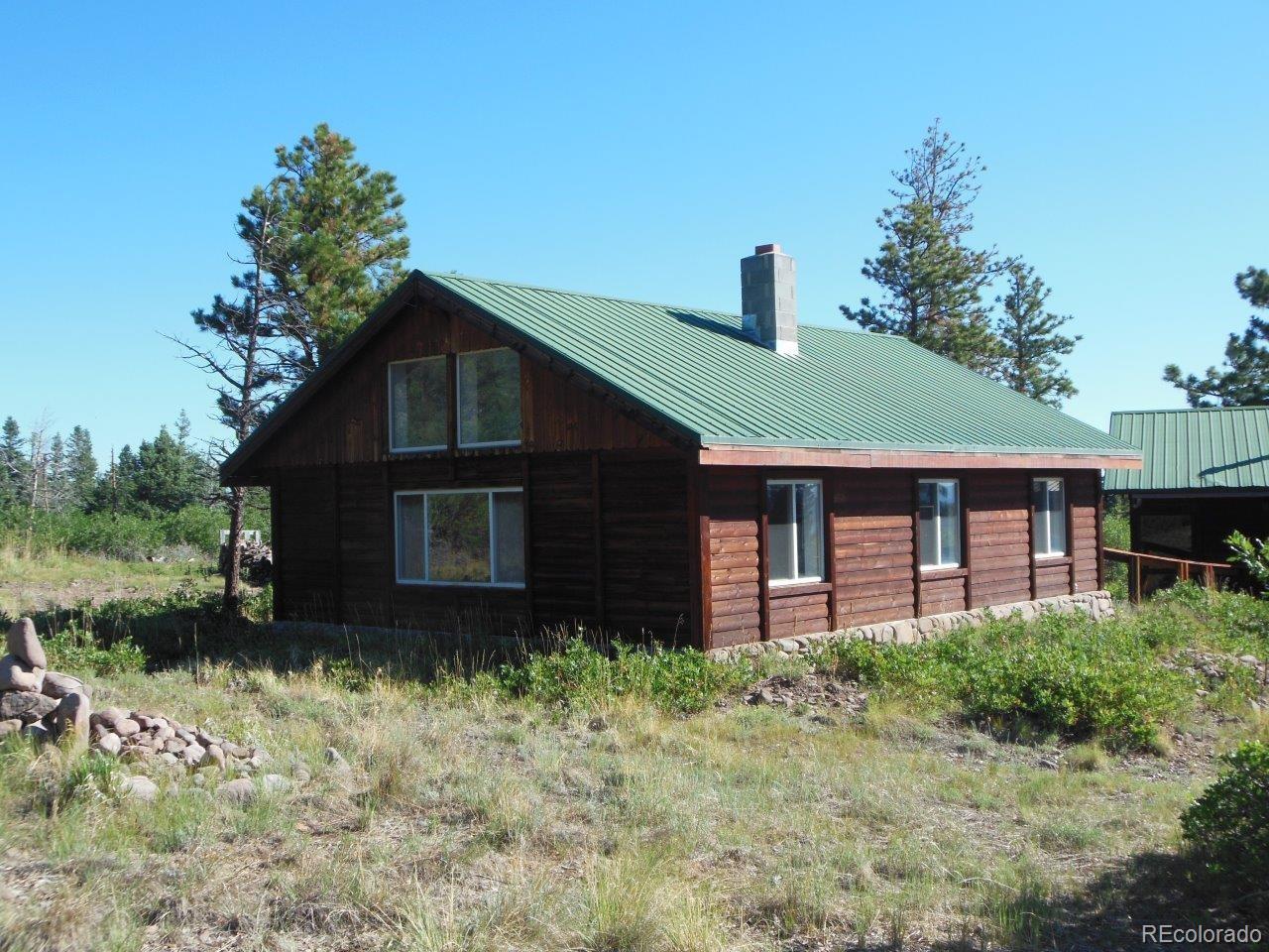 481 San Miguel Road Westcliffe, CO 81252 - Photo 3 of 26 a brick house with green space