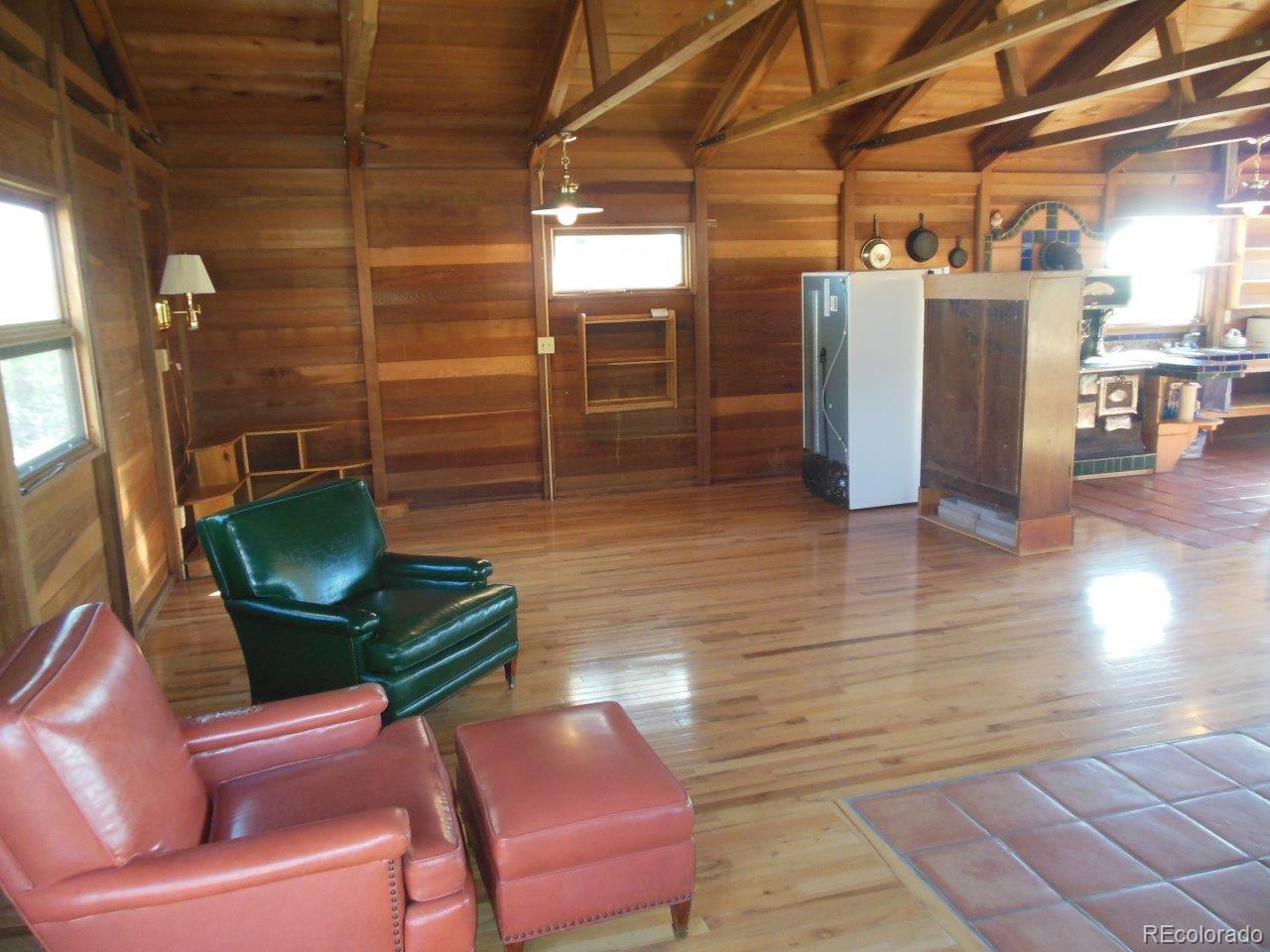 481 San Miguel Road Westcliffe, CO 81252 - Photo 10 of 26 a view of a chairs in a patio