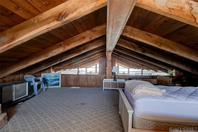 a view of a hallway with stairs