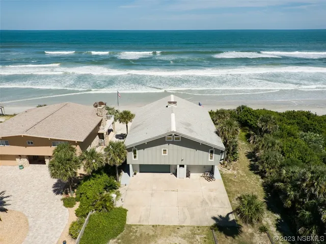 a view of a houses with a ocean view