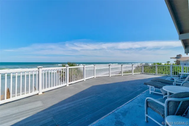 a view of a balcony with wooden floor
