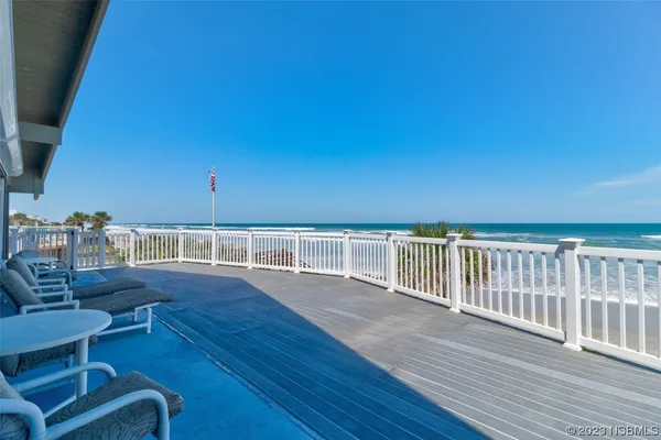 a view of an chairs and table in patio with potted plants
