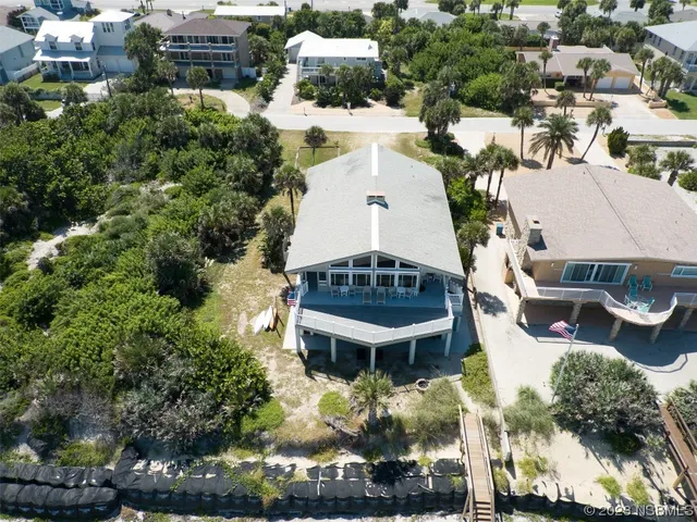 an aerial view of a house with outdoor space