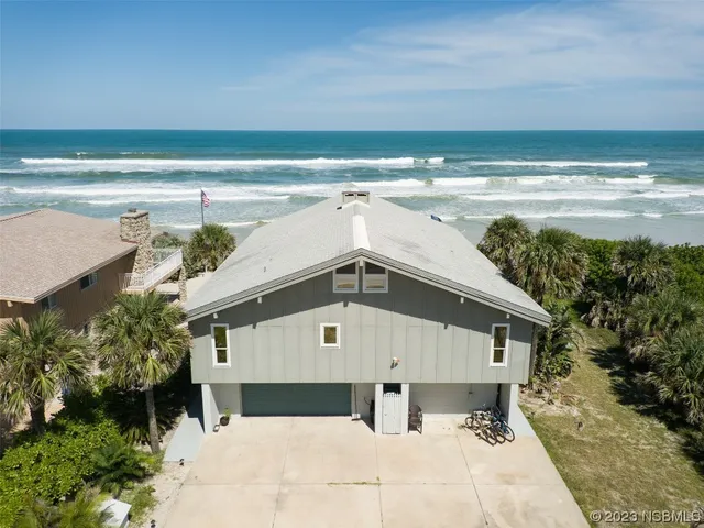 a front view of house with ocean view