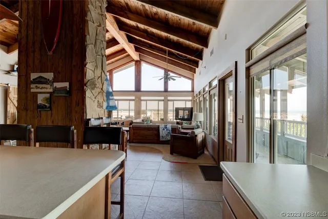 a lobby with furniture and floor to ceiling window