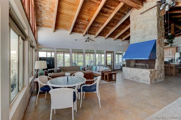 a dining room with furniture and wooden floor