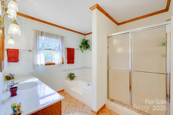 a bedroom with a large bed and a dresser