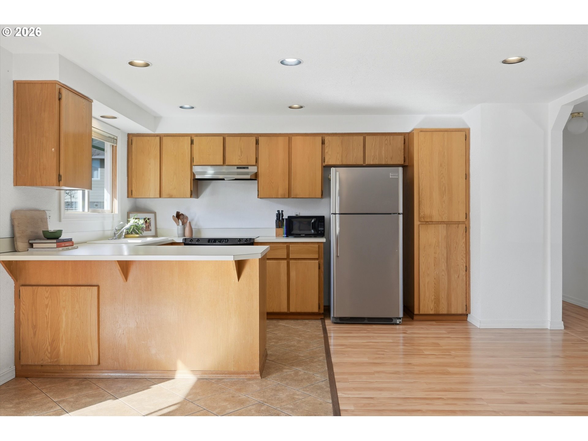 1255 Southwest 217th Avenue Beaverton, OR 97003 - Photo 14 of 33 a kitchen with a refrigerator and a sink