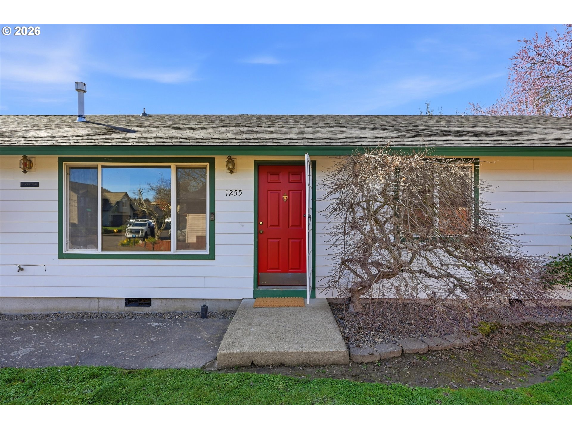 1255 Southwest 217th Avenue Beaverton, OR 97003 - Photo 2 of 33 a view of a brick house with a yard