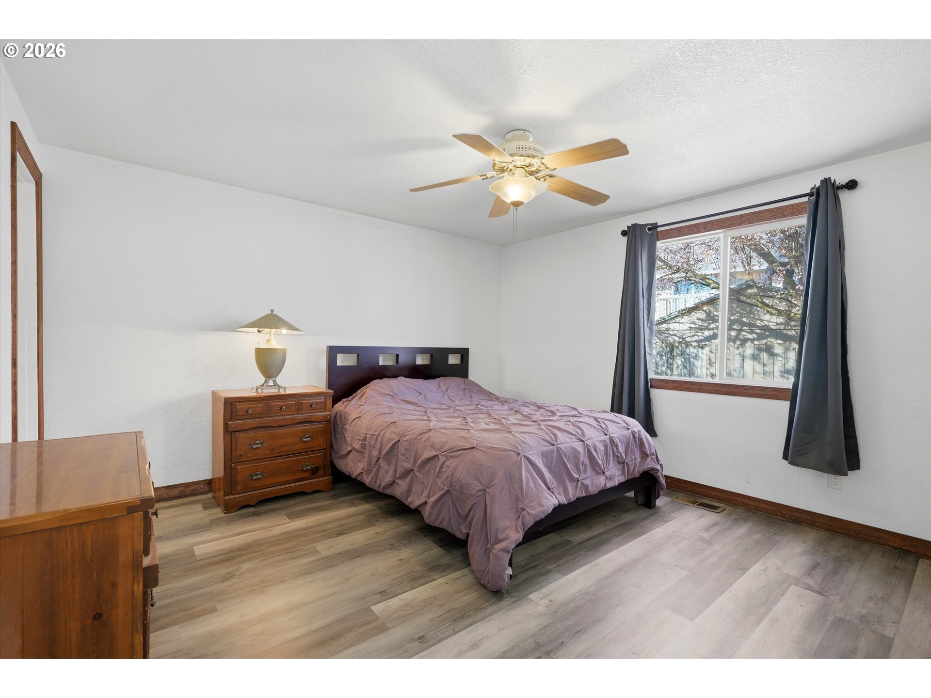 1255 Southwest 217th Avenue Beaverton, OR 97003 - Photo 21 of 33 a bedroom with a bed dresser and a window
