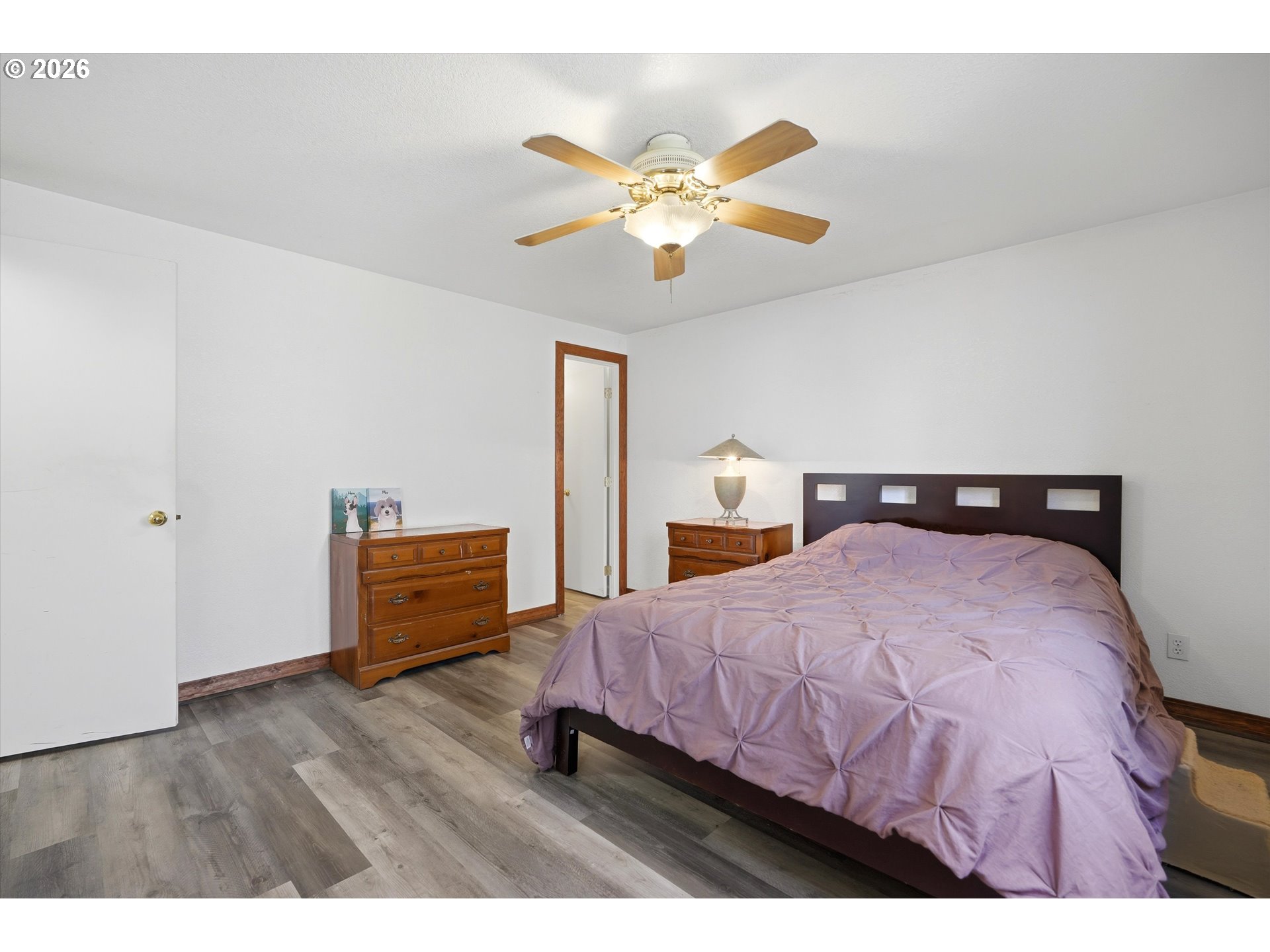 1255 Southwest 217th Avenue Beaverton, OR 97003 - Photo 22 of 33 a bedroom with a bed and a chandelier