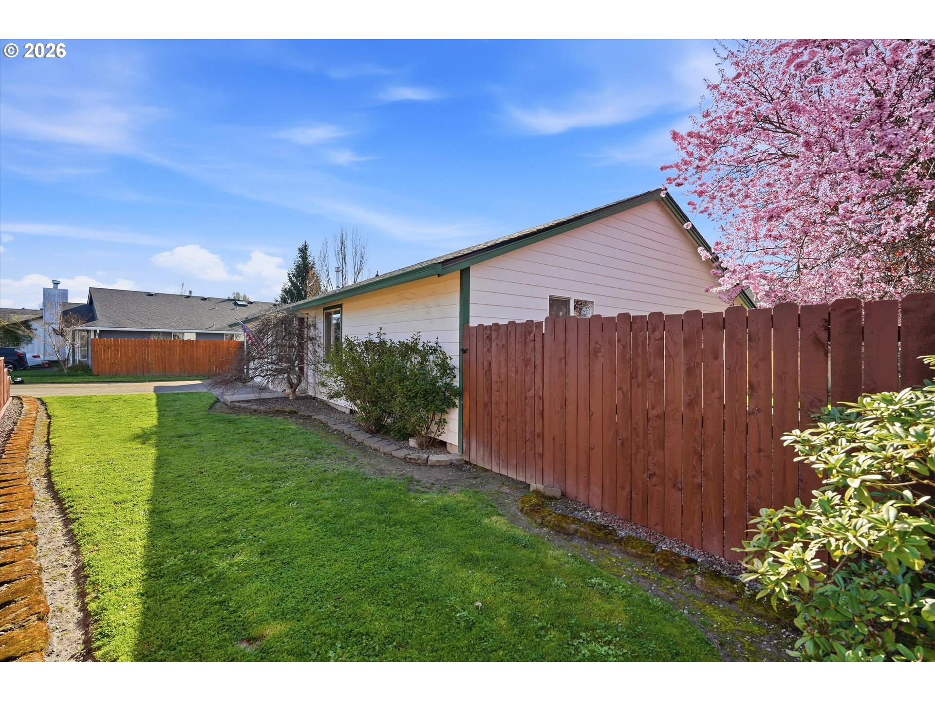 1255 Southwest 217th Avenue Beaverton, OR 97003 - Photo 30 of 33 a backyard of a house with lots of green space