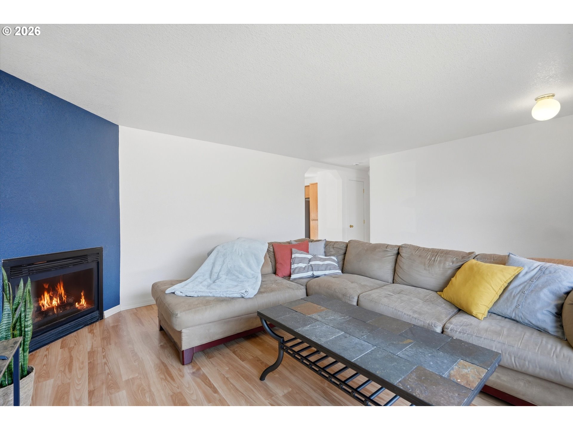 1255 Southwest 217th Avenue Beaverton, OR 97003 - Photo 5 of 33 a living room with furniture and a fireplace