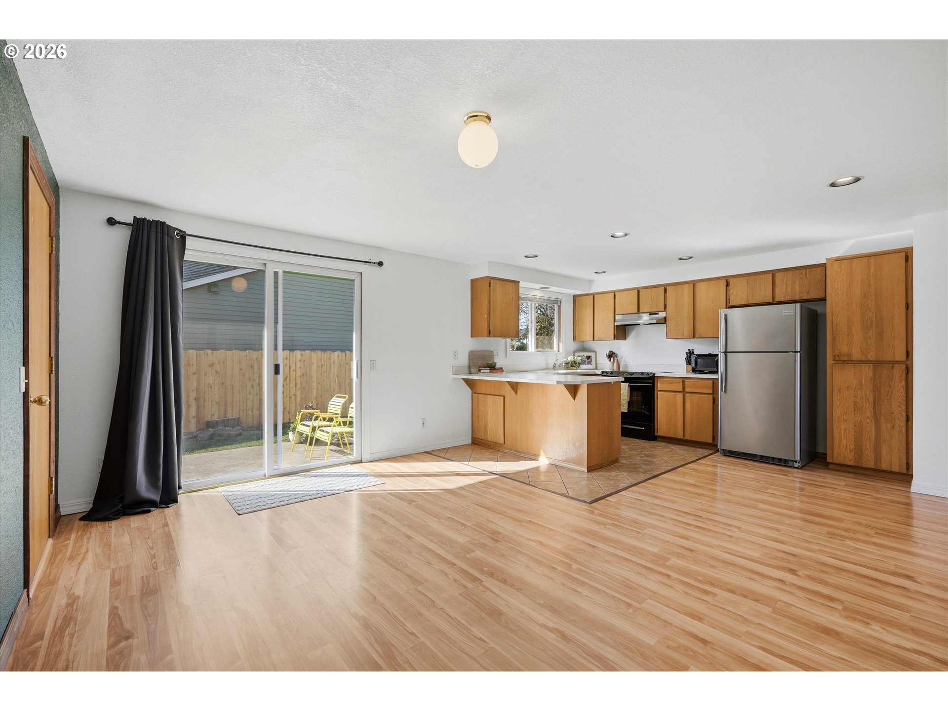 1255 Southwest 217th Avenue Beaverton, OR 97003 - Photo 10 of 33 a view of a kitchen with wooden floor