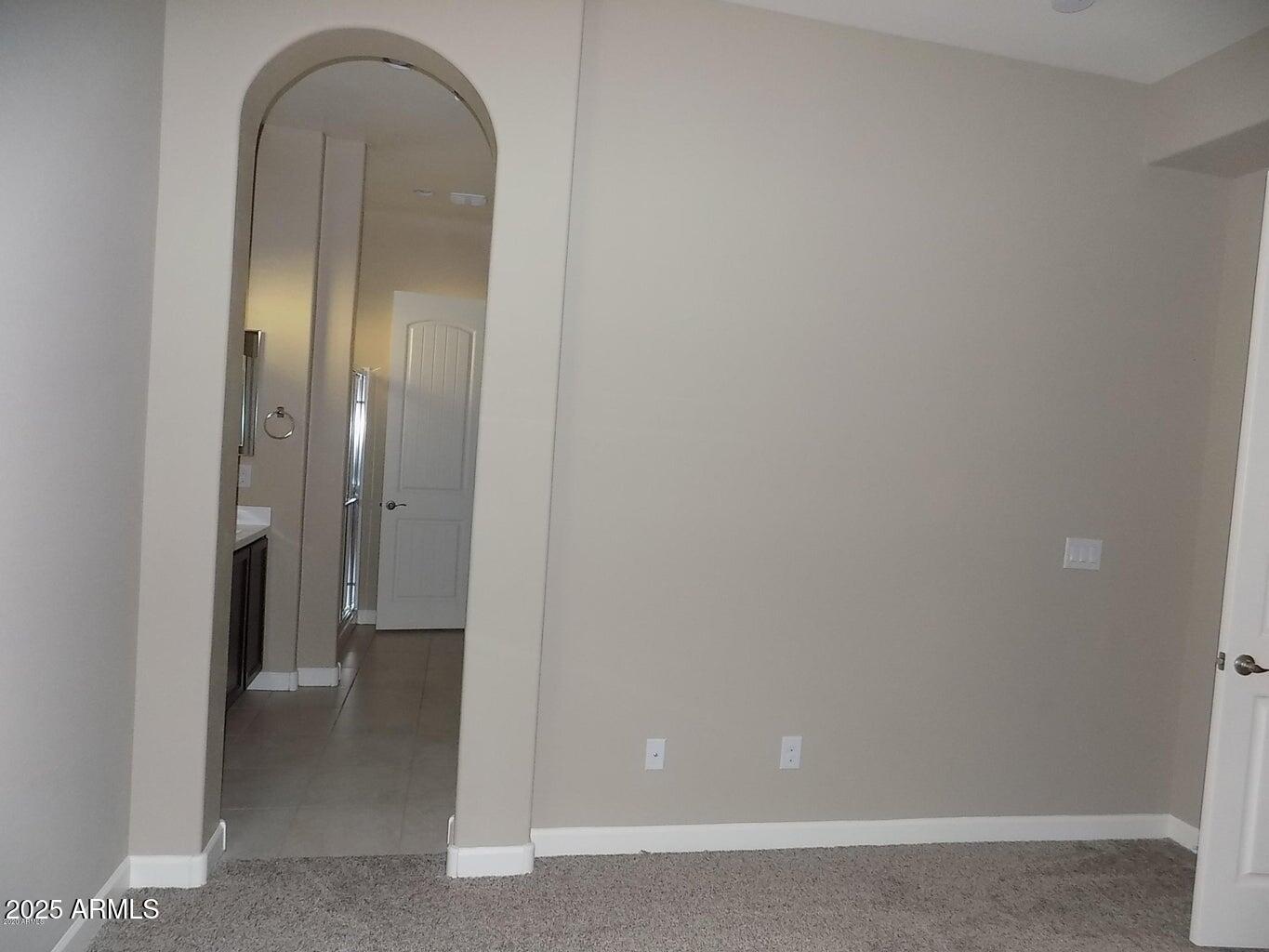 1367 South Country Club Drive, Unit 1076 Mesa, AZ 85210 - Photo 12 of 33 a view of a livingroom with wooden floor and mirror