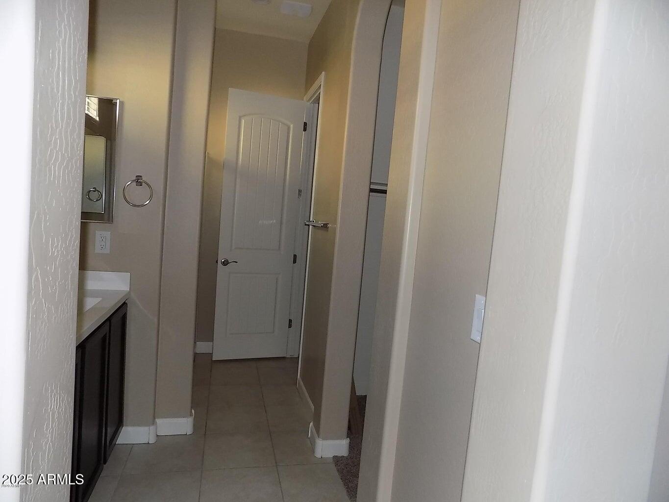 1367 South Country Club Drive, Unit 1076 Mesa, AZ 85210 - Photo 13 of 33 a view of a bathroom from the hallway