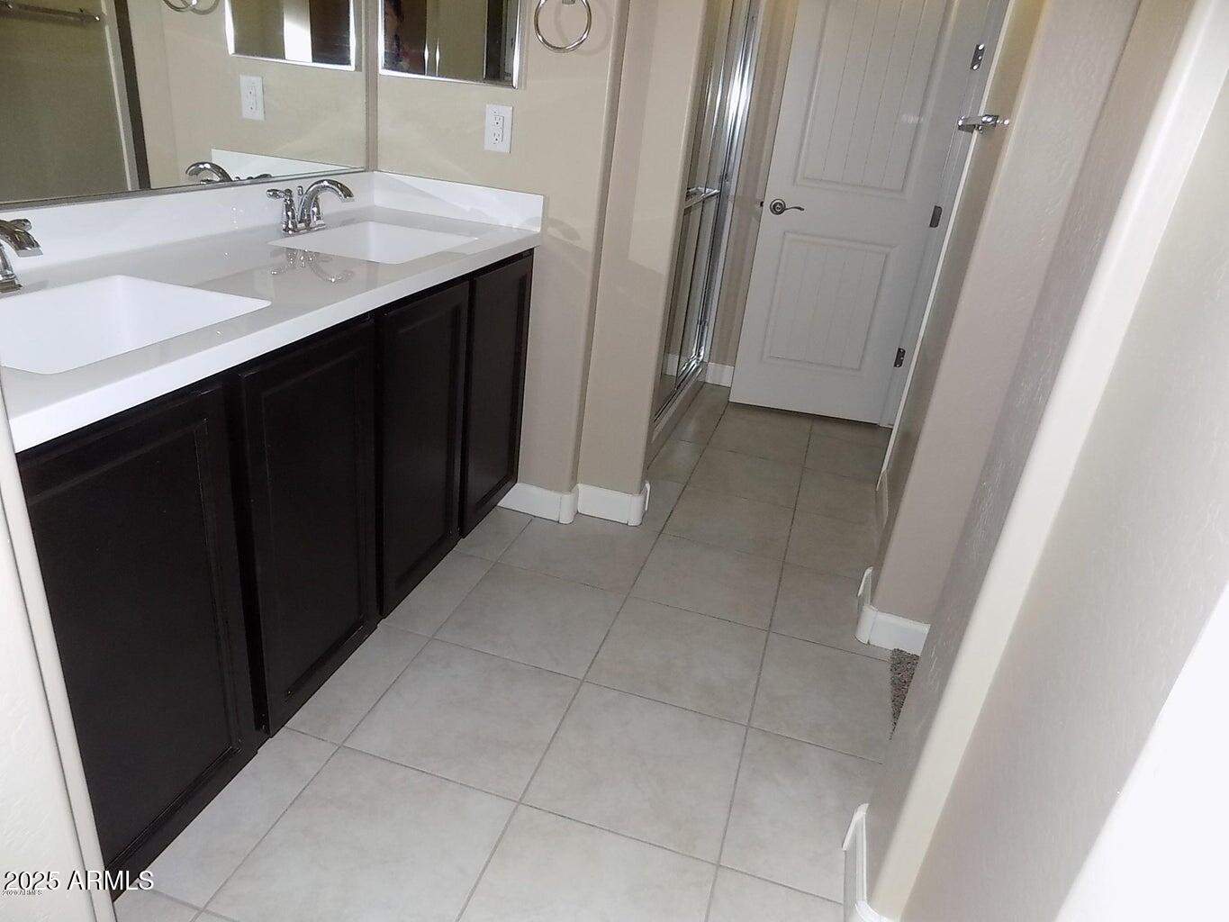1367 South Country Club Drive, Unit 1076 Mesa, AZ 85210 - Photo 14 of 33 a bathroom with a sink and a mirror
