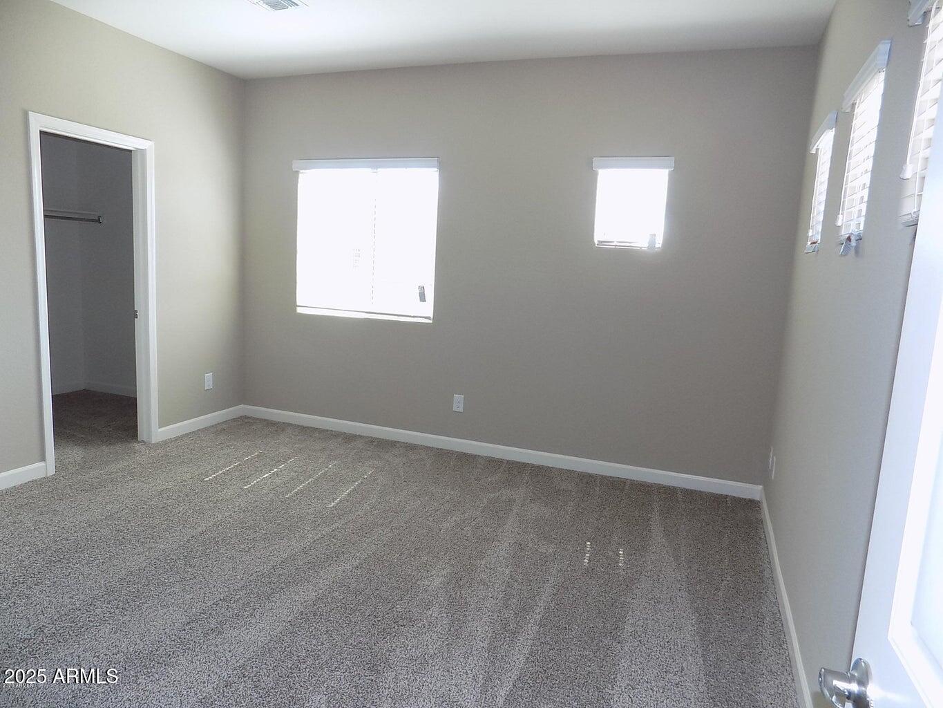 1367 South Country Club Drive, Unit 1076 Mesa, AZ 85210 - Photo 17 of 33 an empty room with windows