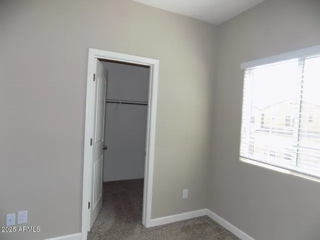a bathroom with a granite countertop shower and a toilet