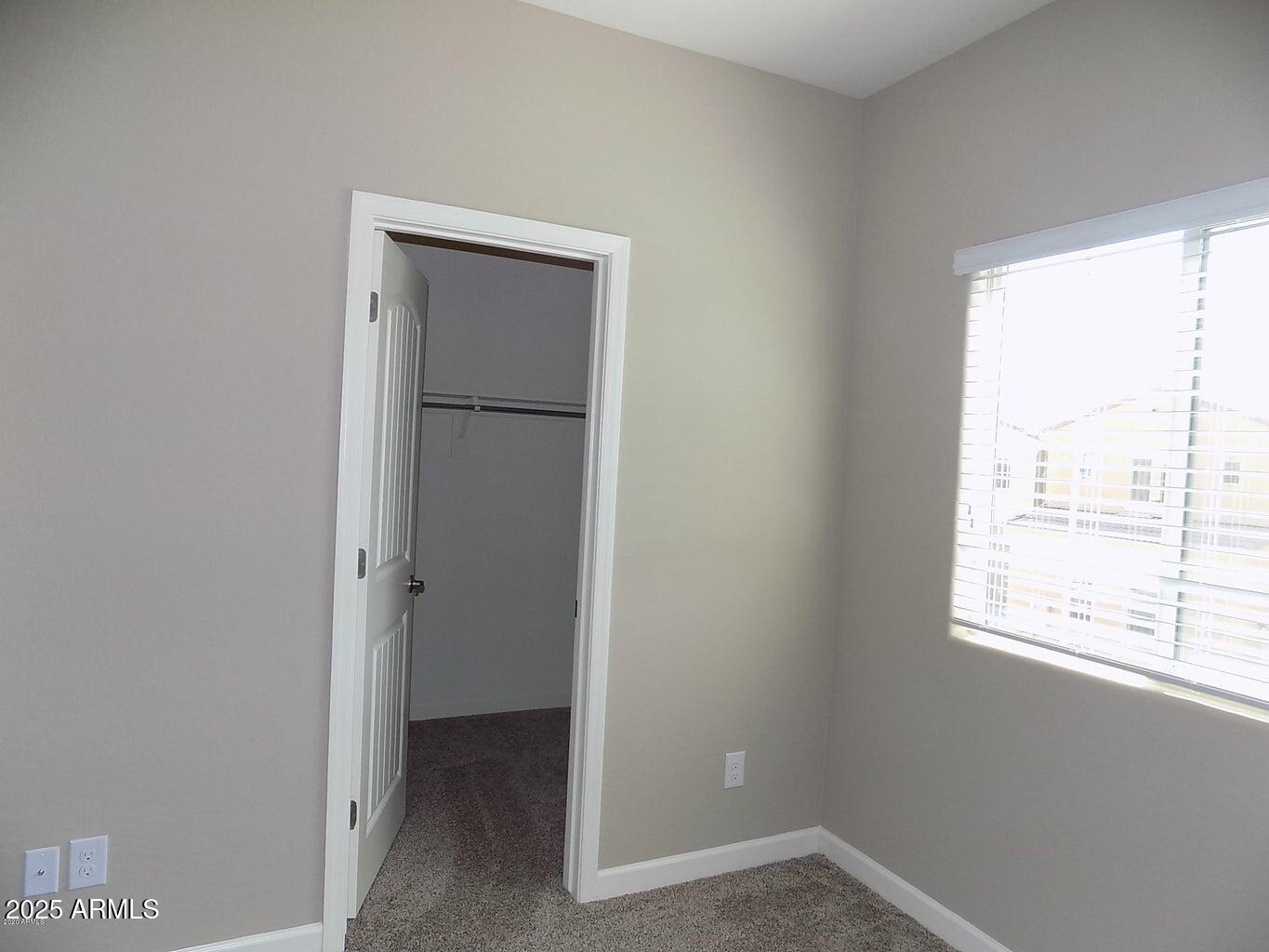 1367 South Country Club Drive, Unit 1076 Mesa, AZ 85210 - Photo 18 of 33 a view of an empty room with a window