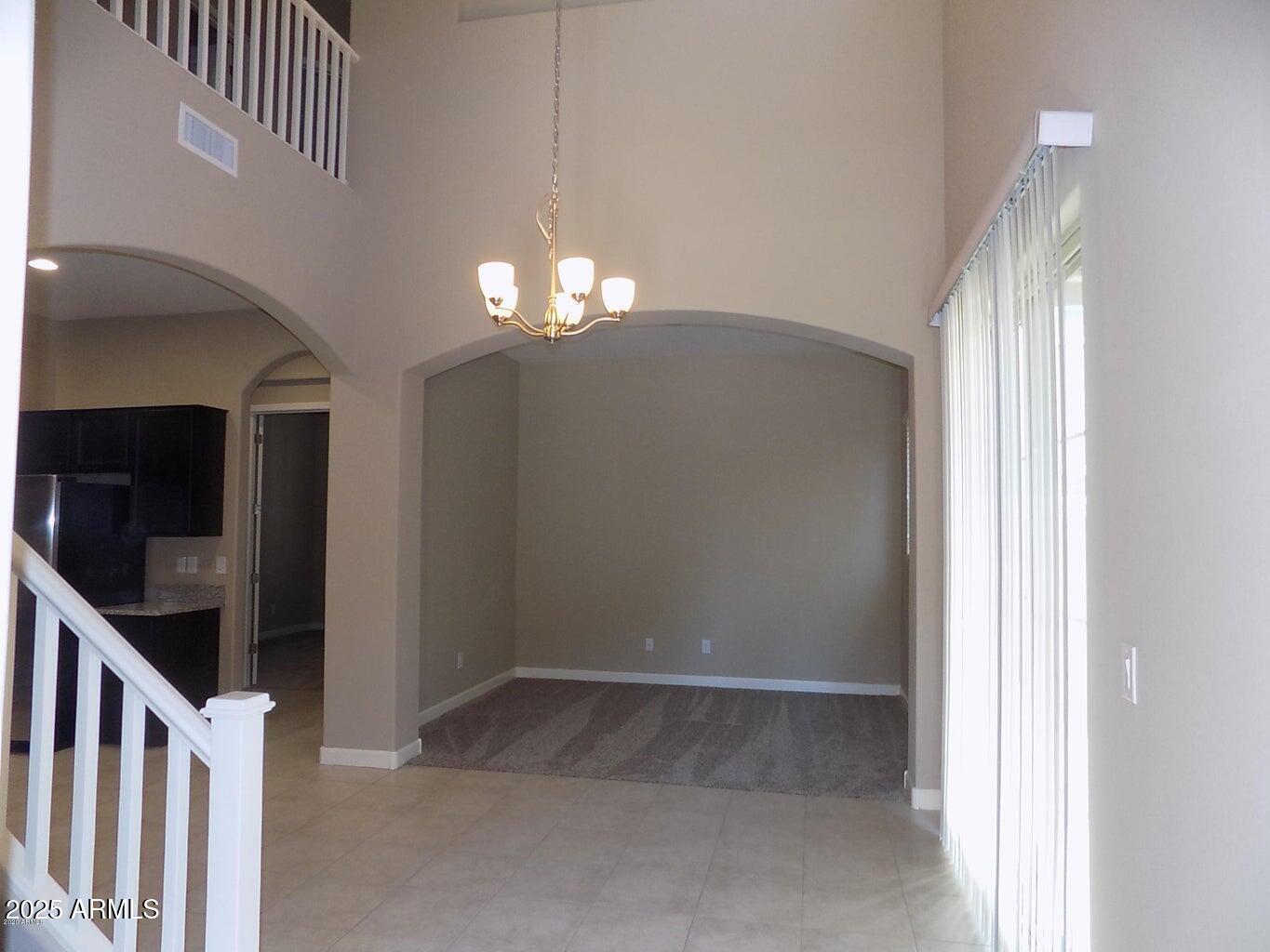 1367 South Country Club Drive, Unit 1076 Mesa, AZ 85210 - Photo 2 of 33 a view of livingroom with chandelier